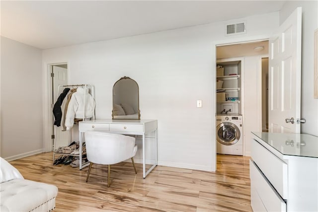 3606 Gillham Rd Unit 25, Kansas City, MO 64111 - office area featuring washer / dryer, light wood-style flooring, and baseboards