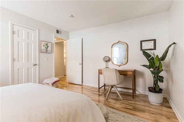 3606 Gillham Rd Unit 25, Kansas City, MO 64111 - bedroom with wood finished floors