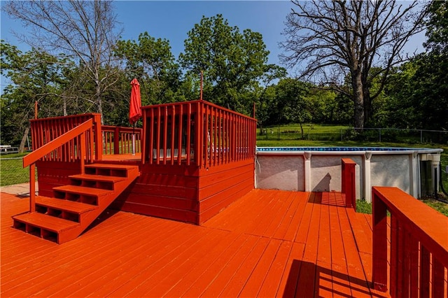 2200 E 126th St, Kansas City, MO 64146 - deck featuring an outdoor pool and view of scattered trees