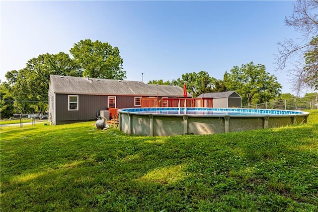 2200 E 126th St, Kansas City, MO 64146 - back of house featuring a lawn and an outdoor pool