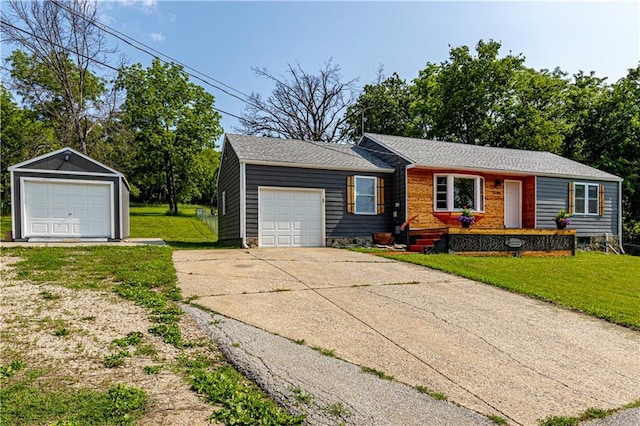 2200 E 126th St, Kansas City, MO 64146 - ranch-style house featuring a front yard, a detached garage, and driveway