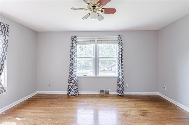 2200 E 126th St, Kansas City, MO 64146 - unfurnished room with light wood-type flooring, ceiling fan, and baseboards