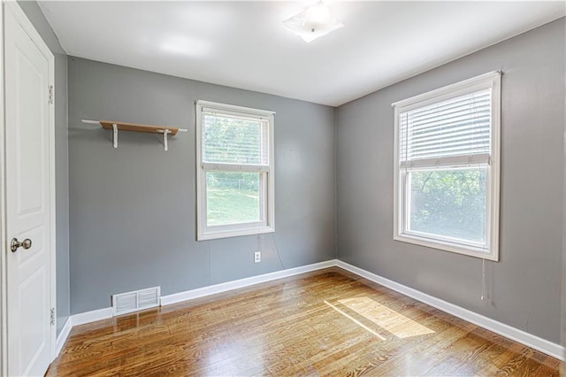 2200 E 126th St, Kansas City, MO 64146 - empty room featuring wood finished floors and baseboards