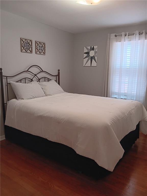 2200 E 126th St, Kansas City, MO 64146 - bedroom featuring wood finished floors