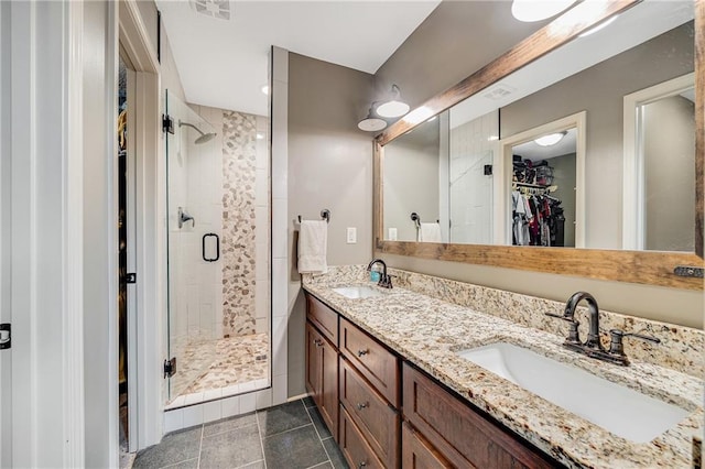 12301 White Oak St, Peculiar, MO 64078 - full bathroom featuring a walk in closet, a shower stall, and double vanity