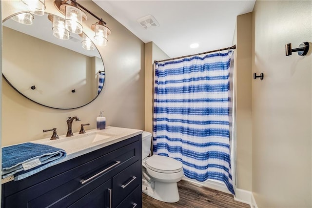 12301 White Oak St, Peculiar, MO 64078 - full bath featuring toilet, vanity, wood finished floors, and a shower with curtain
