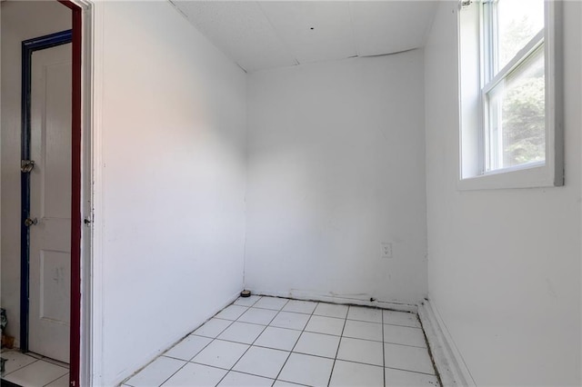7001 Hunter St, Raytown, MO 64133 - empty room with light tile patterned floors