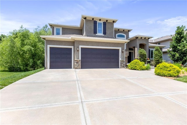 11446 S Longview Rd, Olathe, KS 66061 - view of front of home featuring an attached garage, concrete driveway, stucco siding, and stone siding