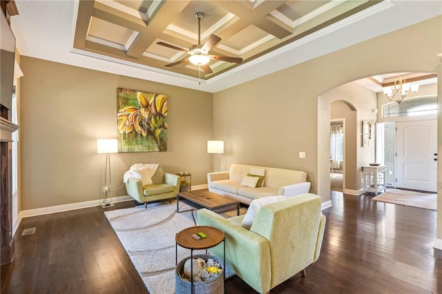 11446 S Longview Rd, Olathe, KS 66061 - living room with arched walkways, crown molding, coffered ceiling, ceiling fan, and wood finished floors