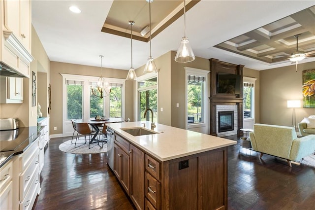 11446 S Longview Rd, Olathe, KS 66061 - kitchen with open floor plan, a fireplace, plenty of natural light, dark wood finished floors, and coffered ceiling