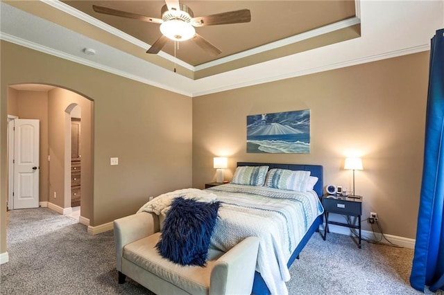 11446 S Longview Rd, Olathe, KS 66061 - bedroom with a raised ceiling, carpet floors, arched walkways, crown molding, and a ceiling fan