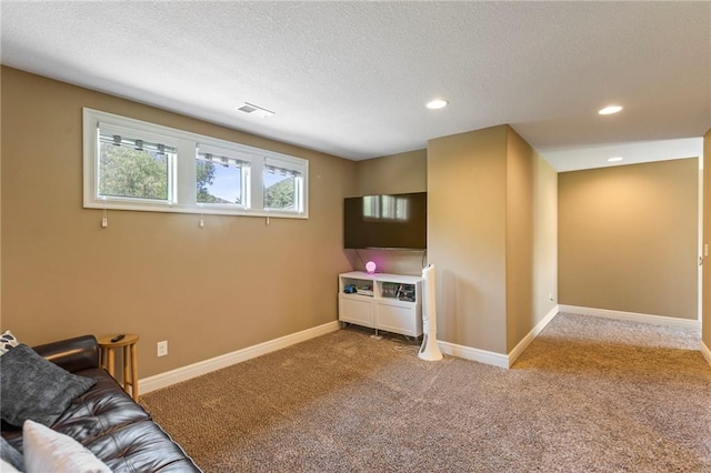 11446 S Longview Rd, Olathe, KS 66061 - carpeted living area with a textured ceiling and recessed lighting