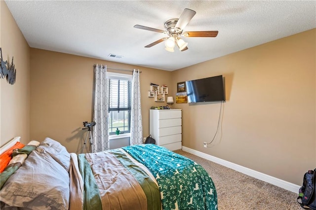 11446 S Longview Rd, Olathe, KS 66061 - carpeted bedroom featuring ceiling fan and a textured ceiling