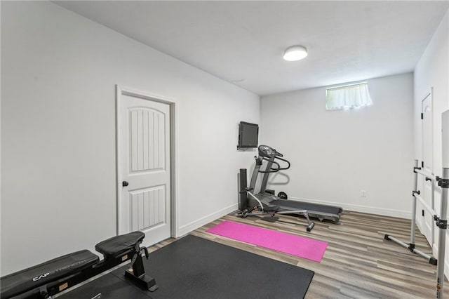 11446 S Longview Rd, Olathe, KS 66061 - workout area with wood finished floors and baseboards