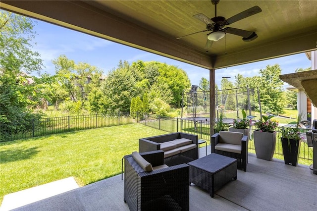 11446 S Longview Rd, Olathe, KS 66061 - fenced backyard featuring a ceiling fan, a patio area, an outdoor hangout area, and view of scattered trees