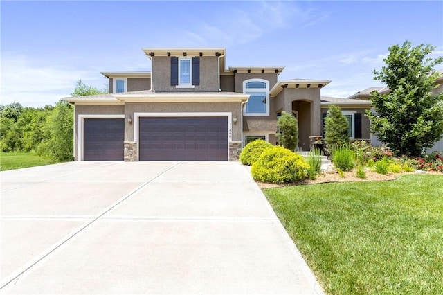 11446 S Longview Rd, Olathe, KS 66061 - view of front facade featuring a front yard, an attached garage, concrete driveway, stucco siding, and stone siding