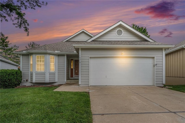 16519 E 53rd Street Ct, Independence, MO 64055 - ranch-style home featuring an attached garage, concrete driveway, a lawn, and roof with shingles