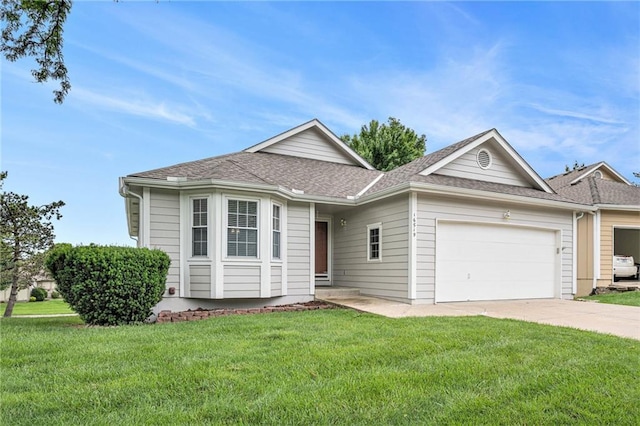 16519 E 53rd Street Ct, Independence, MO 64055 - single story home with an attached garage, driveway, a front yard, and roof with shingles