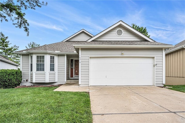 16519 E 53rd Street Ct, Independence, MO 64055 - ranch-style house with concrete driveway, an attached garage, and a front yard
