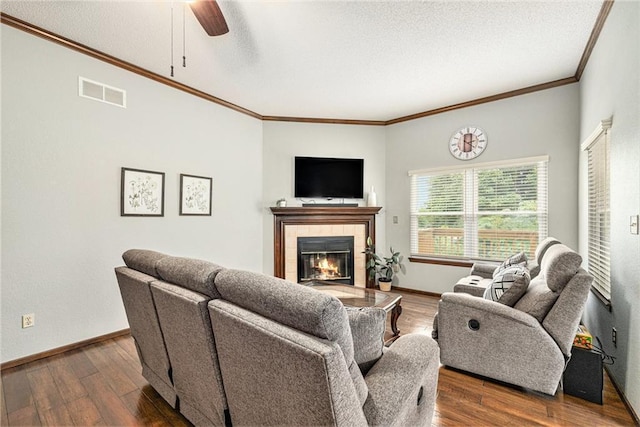 16519 E 53rd Street Ct, Independence, MO 64055 - living area featuring ornamental molding, a fireplace, a ceiling fan, wood finished floors, and baseboards