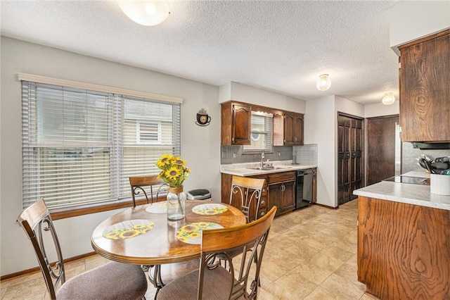 16519 E 53rd Street Ct, Independence, MO 64055 - dining room featuring healthy amount of natural light and a textured ceiling