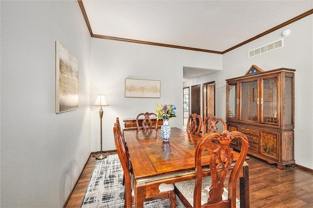 16519 E 53rd Street Ct, Independence, MO 64055 - dining room with dark wood-type flooring, crown molding, and a textured ceiling