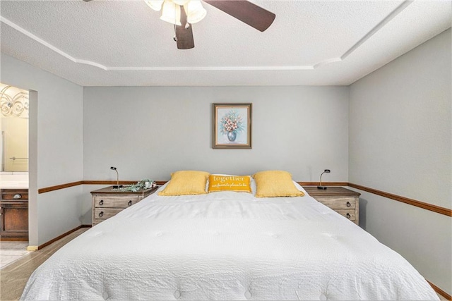16519 E 53rd Street Ct, Independence, MO 64055 - bedroom with connected bathroom, a textured ceiling, a ceiling fan, and baseboards