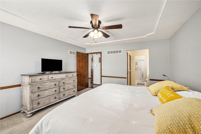 16519 E 53rd Street Ct, Independence, MO 64055 - carpeted bedroom with baseboards, a textured ceiling, ceiling fan, and ensuite bathroom