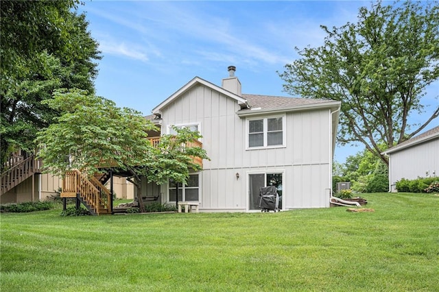 16519 E 53rd Street Ct, Independence, MO 64055 - back of house with a chimney, stairway, a yard, central AC, and a deck