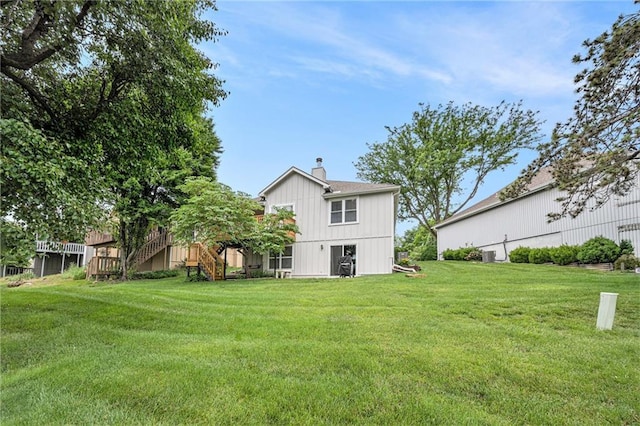 16519 E 53rd Street Ct, Independence, MO 64055 - back of house with a chimney, a lawn, and stairway