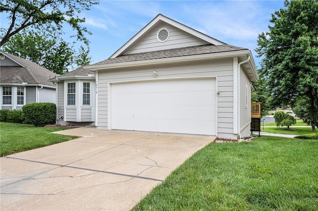 16519 E 53rd Street Ct, Independence, MO 64055 - ranch-style home featuring concrete driveway, a front yard, a shingled roof, and an attached garage