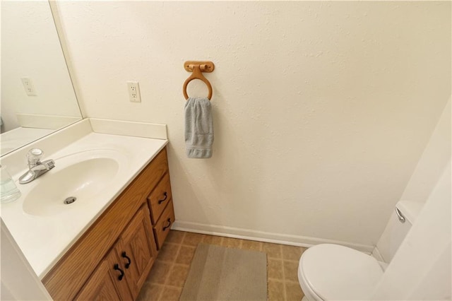 156 SE 1181st Rd, Knob Noster, MO 65336 - bathroom featuring toilet, vanity, and baseboards