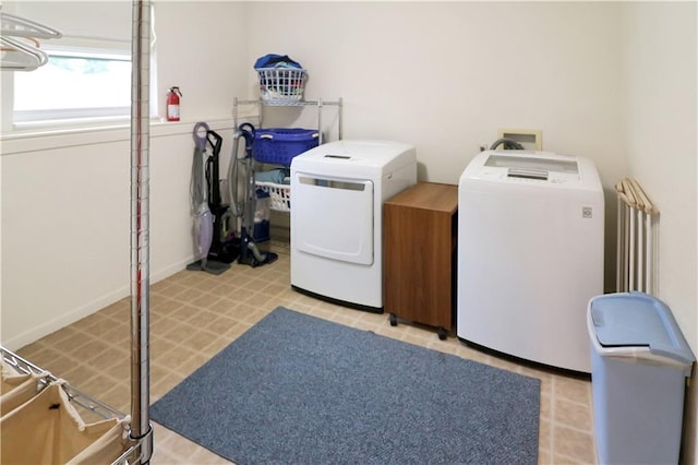 156 SE 1181st Rd, Knob Noster, MO 65336 - laundry area with washer and clothes dryer, radiator, and light flooring