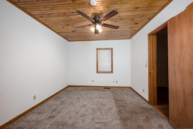 22450 Hatchell Rd, Tonganoxie, KS 66086 - unfurnished bedroom featuring wood ceiling, carpet floors, baseboards, and ceiling fan