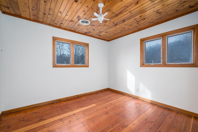 22450 Hatchell Rd, Tonganoxie, KS 66086 - spare room with baseboards, ornamental molding, wood-type flooring, wood ceiling, and ceiling fan