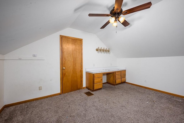 22450 Hatchell Rd, Tonganoxie, KS 66086 - additional living space featuring dark carpet, vaulted ceiling, ceiling fan, baseboards, and an office area