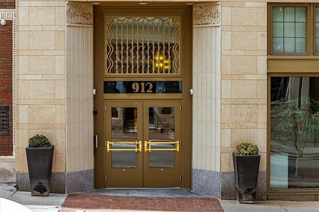 912 Baltimore Ave Unit 401/402, Kansas City, MO 64105 - view of exterior entry with french doors and stone siding