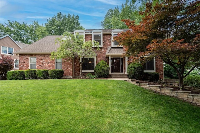 13008 Fontana St, Leawood, KS 66209 - view of front of house with a front lawn, brick siding, and a shingled roof
