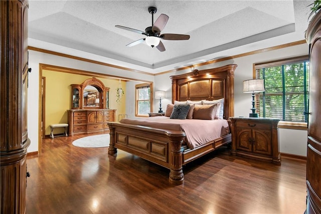 13008 Fontana St, Leawood, KS 66209 - bedroom featuring a tray ceiling, wood finished floors, a textured ceiling, ornamental molding, and baseboards