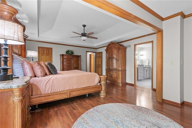 13008 Fontana St, Leawood, KS 66209 - bedroom featuring wood finished floors, a tray ceiling, baseboards, ensuite bathroom, and ornamental molding