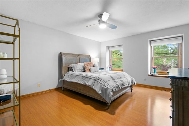 13008 Fontana St, Leawood, KS 66209 - bedroom featuring light wood-style flooring, baseboards, and a ceiling fan