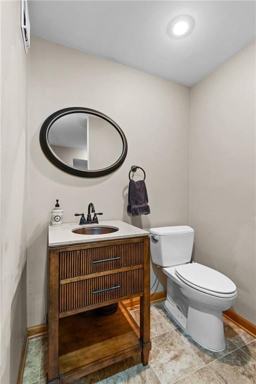 13008 Fontana St, Leawood, KS 66209 - half bath with baseboards, toilet, and vanity