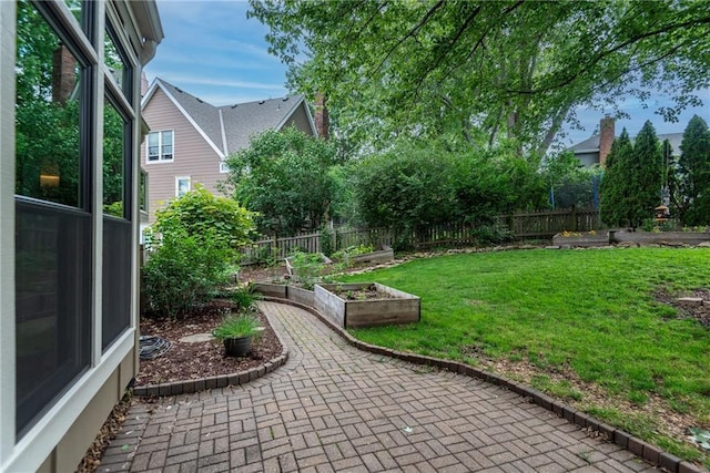 13008 Fontana St, Leawood, KS 66209 - view of yard featuring a garden and a patio area
