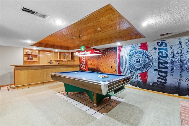 13008 Fontana St, Leawood, KS 66209 - playroom featuring bar area, a textured ceiling, carpet flooring, pool table, and a tray ceiling