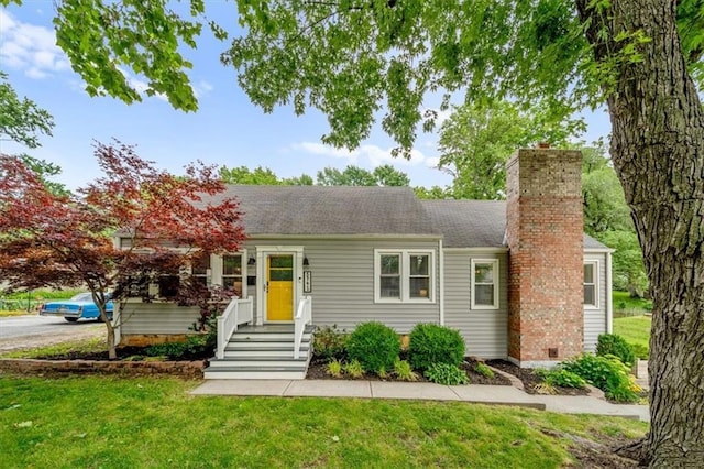 5741 Hadley St, Merriam, KS 66202 - ranch-style home featuring a chimney, a front lawn, and a shingled roof