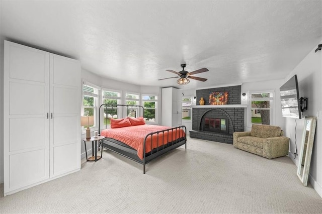 5741 Hadley St, Merriam, KS 66202 - bedroom with carpet floors, a fireplace, a ceiling fan, and baseboards