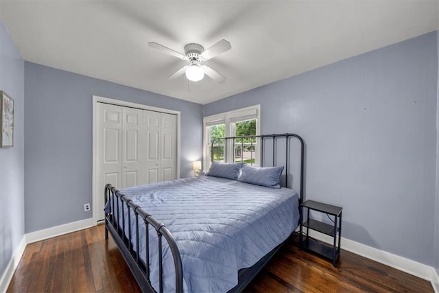5741 Hadley St, Merriam, KS 66202 - bedroom featuring hardwood / wood-style floors, a closet, baseboards, and a ceiling fan
