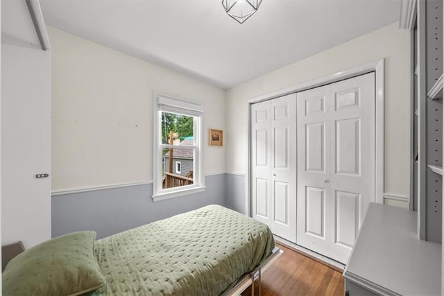 5741 Hadley St, Merriam, KS 66202 - bedroom with wood finished floors and a closet