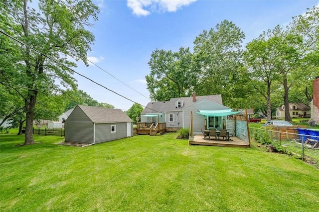 5741 Hadley St, Merriam, KS 66202 - rear view of house with a wooden deck and outdoor dining area