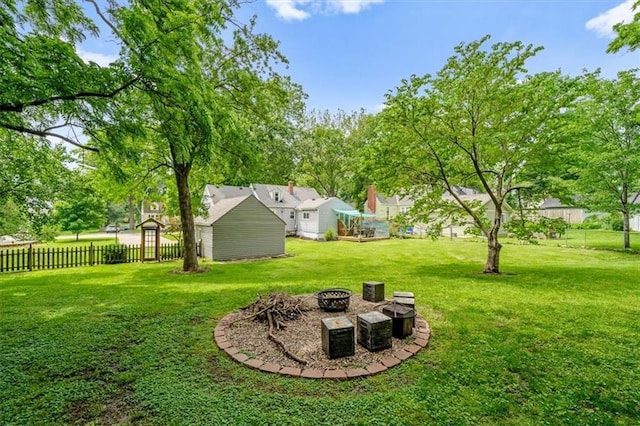 5741 Hadley St, Merriam, KS 66202 - view of yard featuring a fire pit and an outbuilding